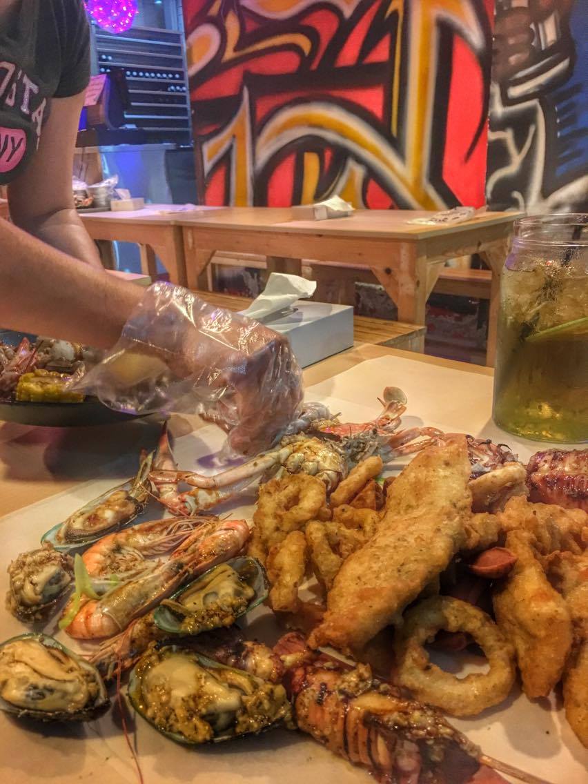 filipino boodle fight in Dubai seafood in a bucket