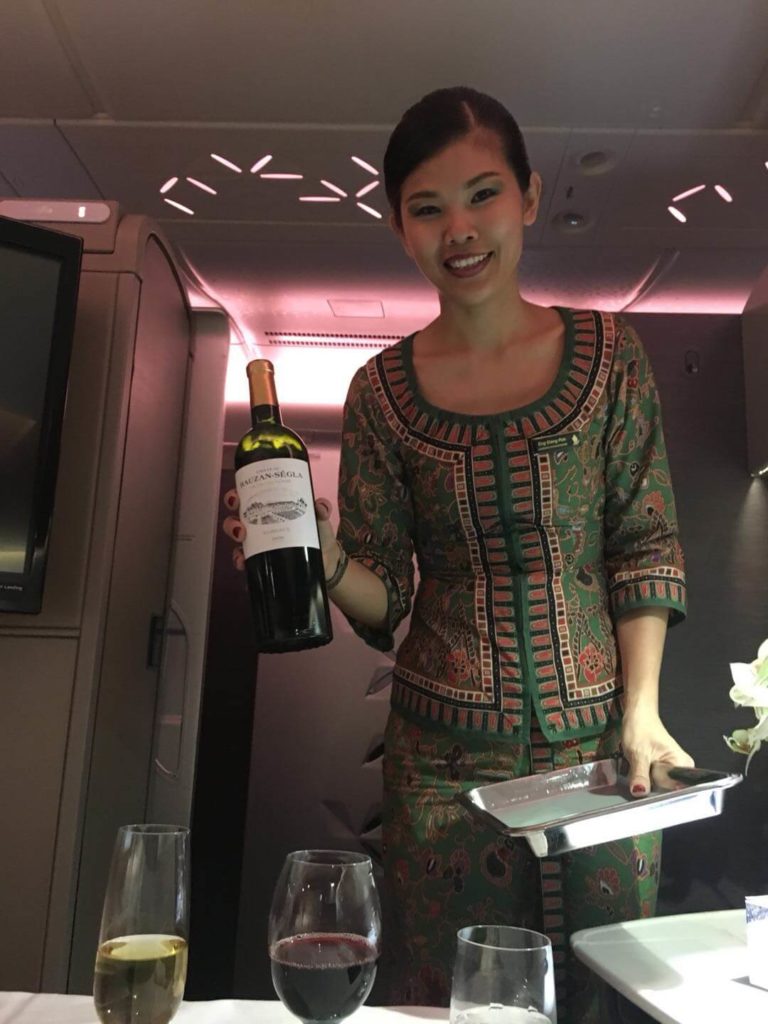 Singapore Airlines First Class suites crew wine