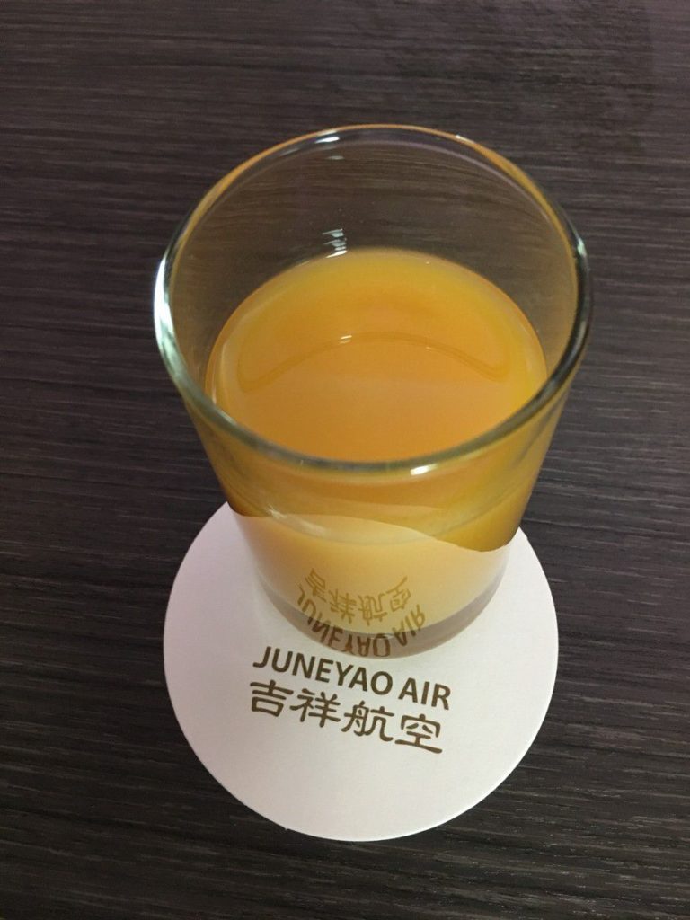 juneyao business class dreamliner b787-9 orjange juice